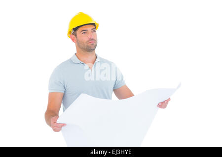 Thoughtful male architect holding blueprint Stock Photo