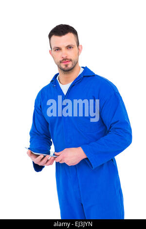 Mechanic using digital tablet Stock Photo