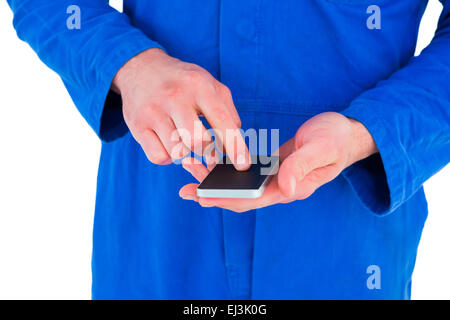 Mechanic using mobile phone Stock Photo