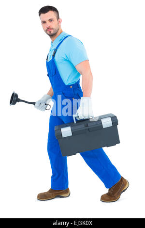 Plumber with plunger and toolbox Stock Photo