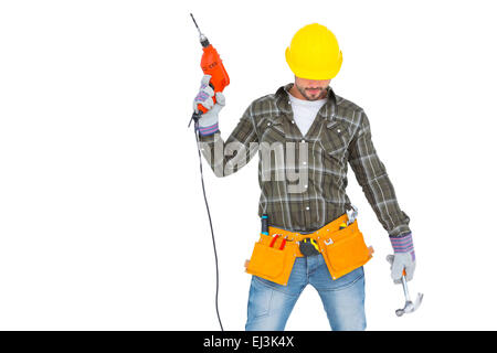 Repairman holding hammer and drill machine Stock Photo