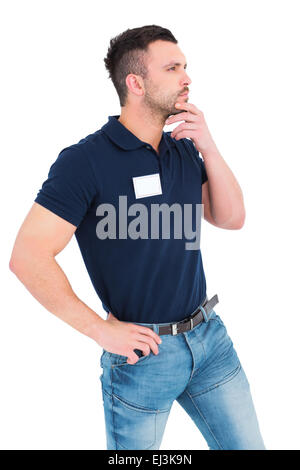 Thoughtful technician with hand on chin Stock Photo