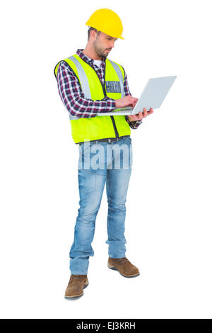 Handyman using laptop Stock Photo