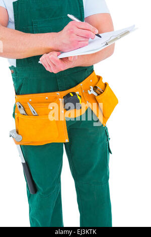 Repairman writing on a clipboard Stock Photo