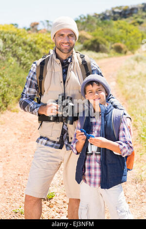 Father and son hiking in the mountains Stock Photo
