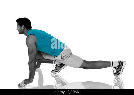 Composite image of side view of a fit man doing stretching exercise Stock Photo
