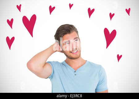 Composite image of young man posing with hands on head Stock Photo