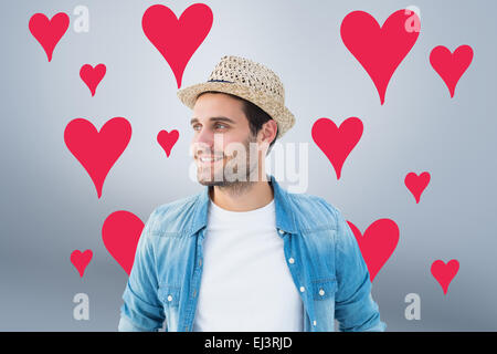 Composite image of handsome hipster wearing a trilby Stock Photo