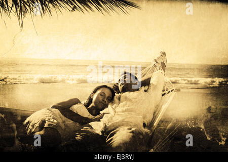 Composite image of calm couple napping in a hammock Stock Photo