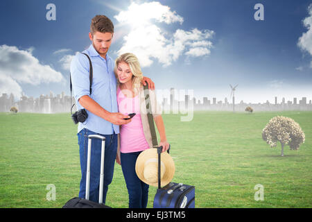 Composite image of attractive young couple ready to go on vacation Stock Photo