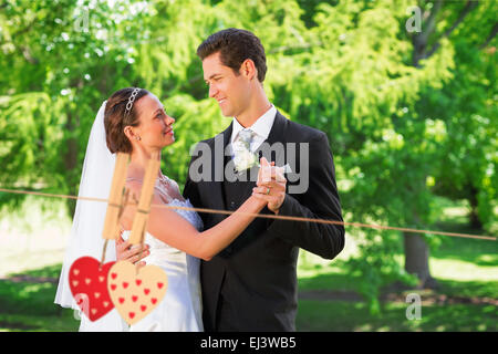 Composite image of couple dancing on wedding day Stock Photo