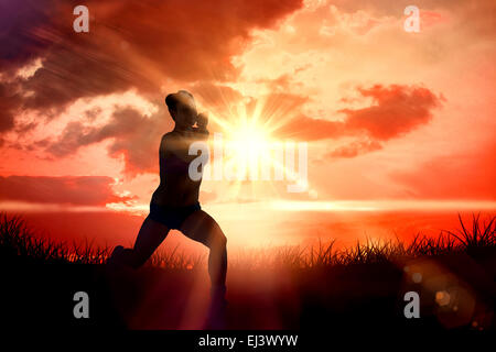 Composite image of fit brunette running and jumping Stock Photo