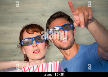 Composite image of couple enjoying a movie night Stock Photo