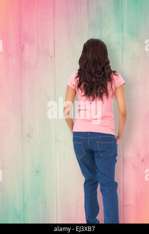 Composite image of pretty brunette stepping Stock Photo