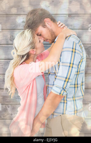 Composite image of attractive young couple about to kiss Stock Photo