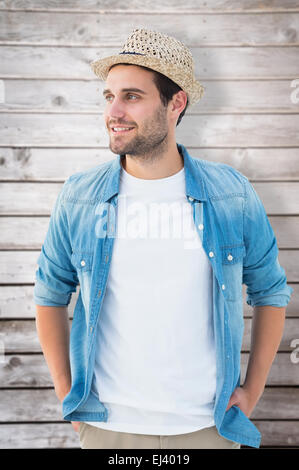 Composite image of handsome hipster wearing a trilby Stock Photo