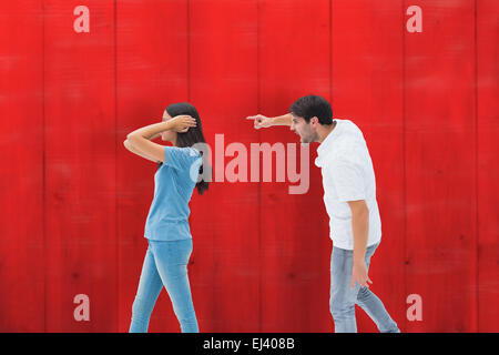 Composite image of angry boyfriend shouting at girlfriend Stock Photo