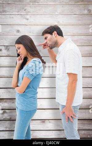 Composite image of angry man shouting at girlfriend Stock Photo