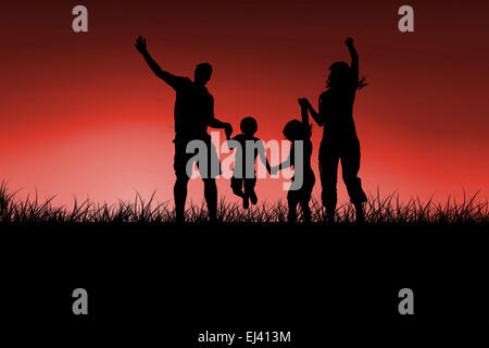 Composite image of silhouette of family jumping Stock Photo