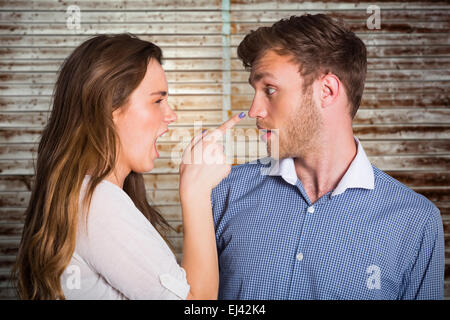 Composite image of casual young couple in an argument Stock Photo