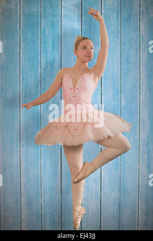 Composite image of pretty ballerina dancing Stock Photo