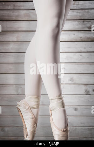 Composite image of ballerina standing en pointe Stock Photo