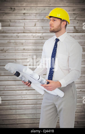 Composite image of thoughtful young architect posing Stock Photo