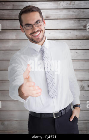 Composite image of happy businessman with glasses offering handshake ...