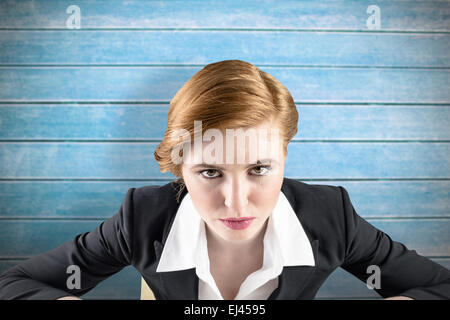 Composite image of focused businesswoman Stock Photo