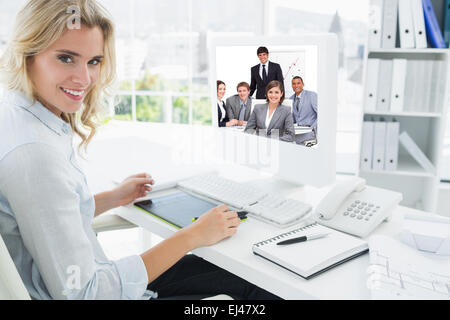 Composite image of happy business group having a meeting Stock Photo