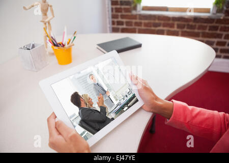 Composite image of business people in office at presentation Stock Photo