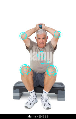 Composite image of full length portrait of a senior man exercising Stock Photo