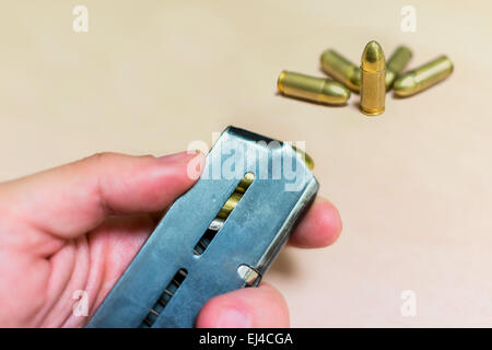 fired bullets, bullet casings photographed up close on a blue