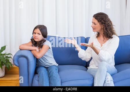 Upset mother looking at her daughter Stock Photo