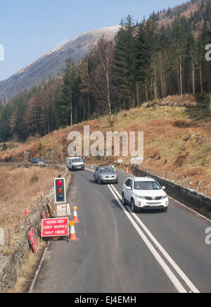 Traffic lights controlled single lane operation due to road works near Thirlmere, England UK Stock Photo