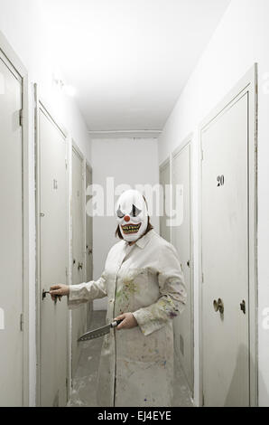 Psychotic clown inside hospital, halloween Stock Photo