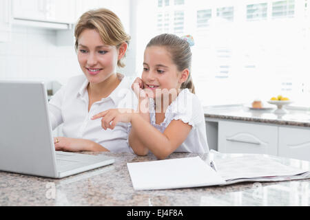 Mother and daughter using laptop Stock Photo