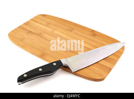 Knife over wooden cutting board Stock Photo
