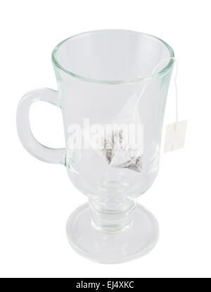 Glass teacup with a tea bag inside Stock Photo