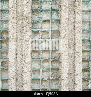 Old wall made of broken glass bricks Stock Photo