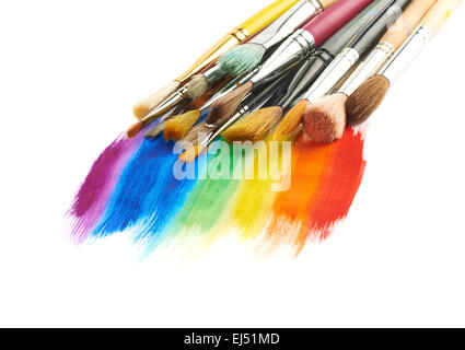 Pile of different brushes over the paint strokes Stock Photo