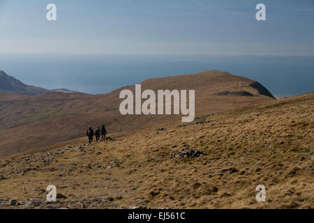 Walkers heading down the Pony Path on Cadair Idris in southern Snowdonia, north Wales Stock Photo