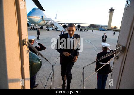US President Barack Obama boards Marine One at Joint Base Andrews, en route to the White House following a trip to New Jersey December 15, 2014 in Andrews, Maryland. Stock Photo