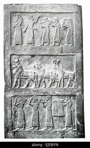 These details are from the black limestone obelisk of Shalmaneser III and dates to 854-824 B.C. It was found in 1846 by Henry Layard who was excavating the ancient Assyrian capital of Kalhu (Nimrud). These scenes from the second side of the obelisk and show, from top to bottom: (1) tribute bearers of Jebu, King of Israel, (2) tributary animals, (3) tribute bearers with shawls and bags. The obelisk is now housed in the British Museum. Stock Photo