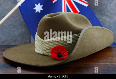 Anzac army slouch hat with Australian Flag on vintage wood background. Stock Photo