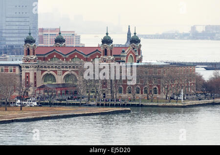 The Main Building of the Ellis Island Immigration Museum seen from the Statue of Liberty on a rainy afternoon, New York City. Stock Photo