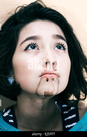 young beautiful upset girl nosebleeding Stock Photo
