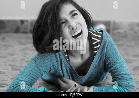 pretty young girl with a bleeding nose after falling down Stock Photo