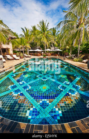 Colorful tiled water pool at Mia Resort Mui Ne. Mui Ne, Binh Thuan Province, Vietnam. Stock Photo