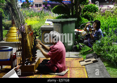 Old man thai people playing Angklung show traveler at Chiang Rai, Thailand. Stock Photo